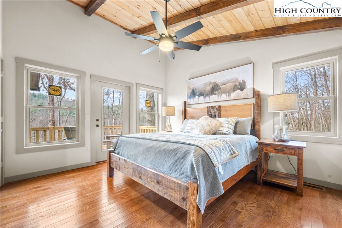 214 Ridge Run Road West Jefferson, NC 28694 - Photo 19 of 49 a bed sitting in a bedroom next to a window