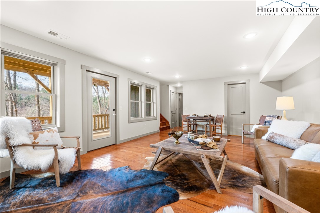 214 Ridge Run Road West Jefferson, NC 28694 - Photo 24 of 49 a living room with furniture and a large window