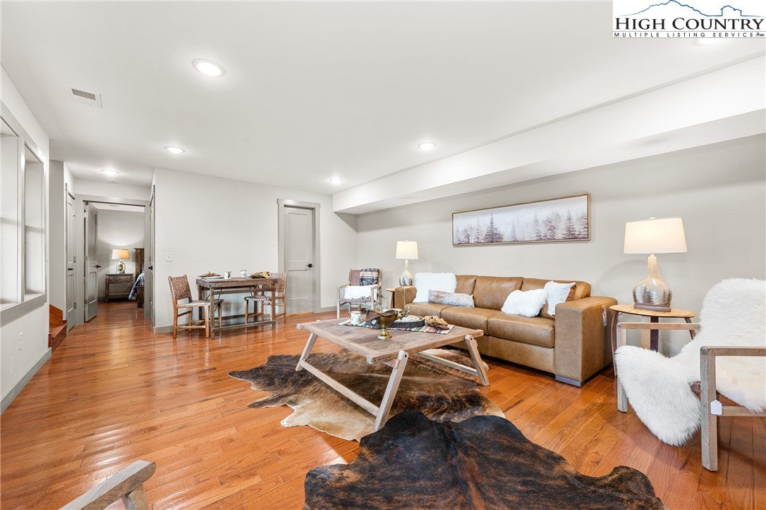 214 Ridge Run Road West Jefferson, NC 28694 - Photo 25 of 49 a living room with furniture and wooden floor