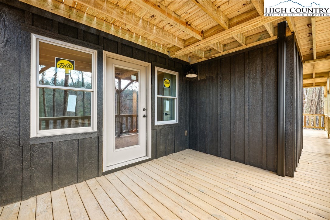 214 Ridge Run Road West Jefferson, NC 28694 - Photo 33 of 49 a view of a house with a wooden door