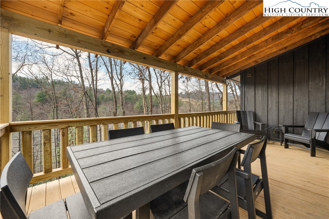 214 Ridge Run Road West Jefferson, NC 28694 - Photo 34 of 49 a view of a balcony with wooden floor and outdoor seating