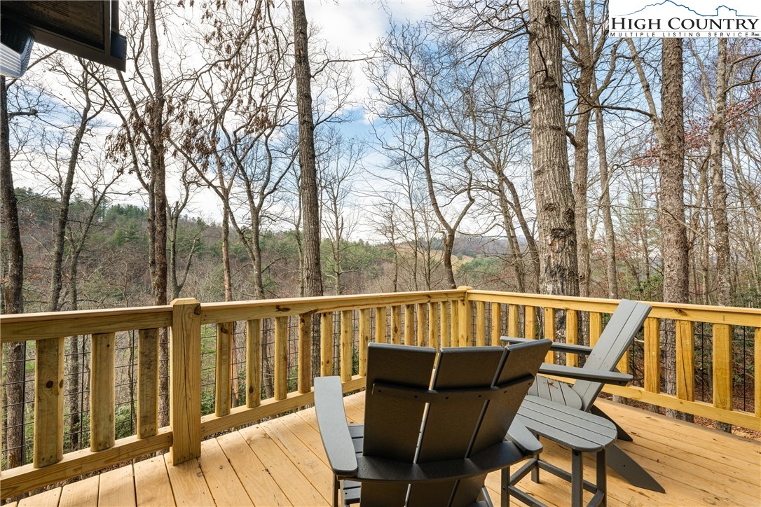 214 Ridge Run Road West Jefferson, NC 28694 - Photo 37 of 49 a view of a chairs and table on the deck