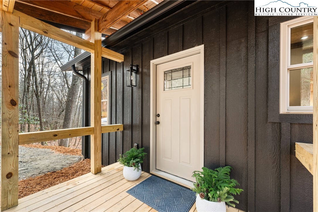 214 Ridge Run Road West Jefferson, NC 28694 - Photo 41 of 49 a view of a porch with wooden floor and stairs