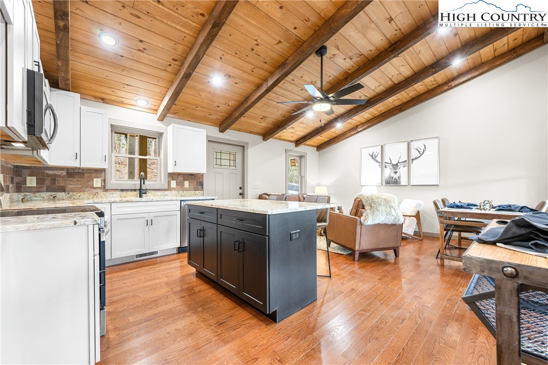 214 Ridge Run Road West Jefferson, NC 28694 - Photo 6 of 49 a large white kitchen with lots of counter top space