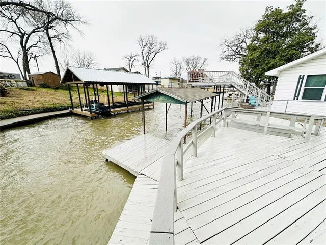 a view of a swimming pool with a deck