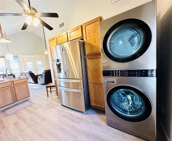 a view of a hallway with washer and dryer