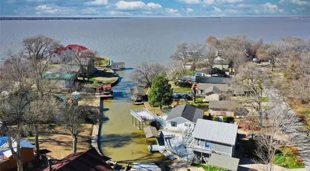 an aerial view of a houses with outdoor space