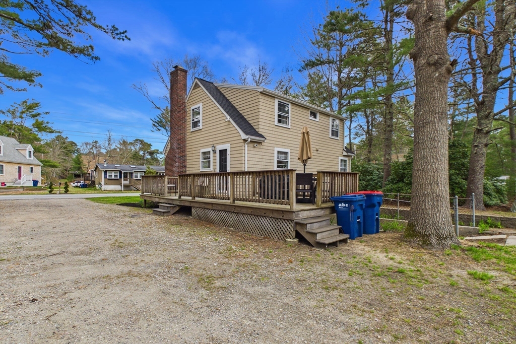 13 Albatross Avenue Wareham, MA 02538 - Photo 22 of 25 a view of a house with backyard and a tree