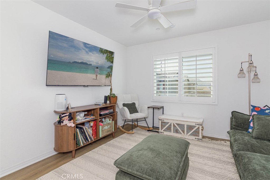 7395 Olive Grv Street Riverside, CA 92507 - Photo 6 of 18 Great room with ceiling fan and plantation shutters.
