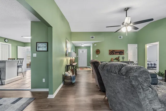 a kitchen with stainless steel appliances granite countertop a refrigerator sink and stove