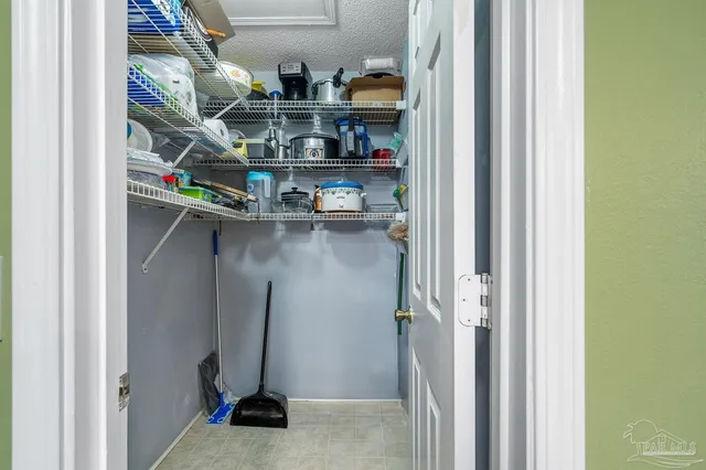 a hallway with a dining table and chairs