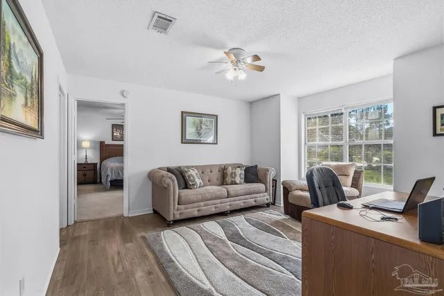 a bedroom with a bed closet and a window
