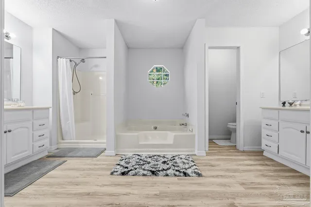 a bathroom with a bathtub sink and a mirror