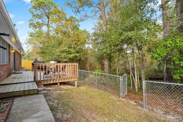 a backyard of a house with lots of green space