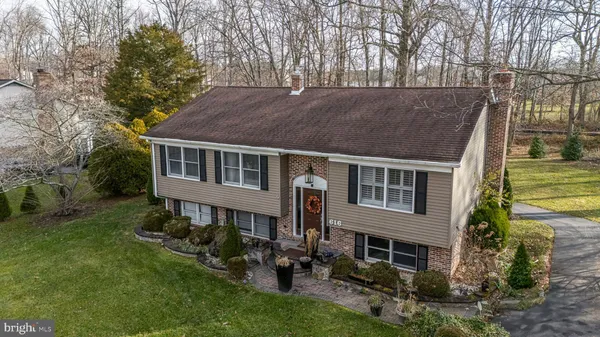a aerial view of a house with a yard