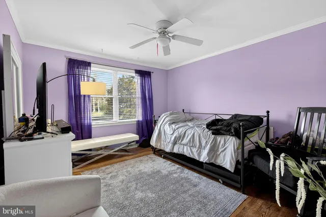 a bed room with a bed and a chair