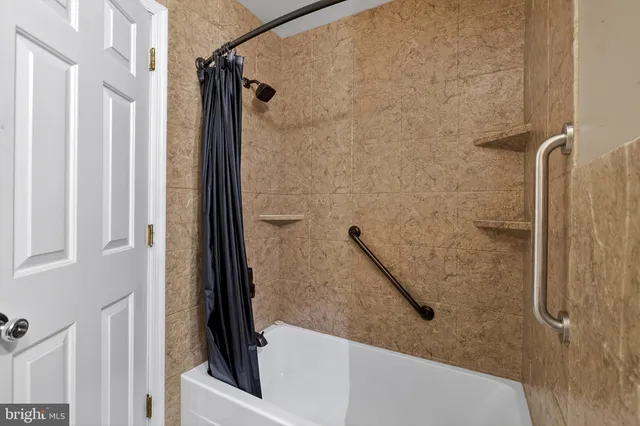 a room with lots of white furniture and appliances