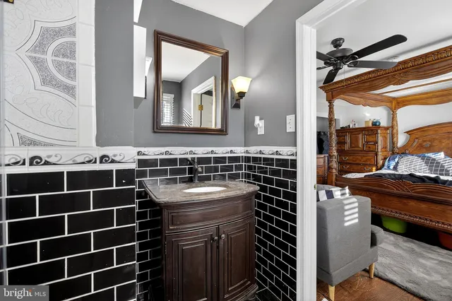 a bathroom with a toilet a sink and shower