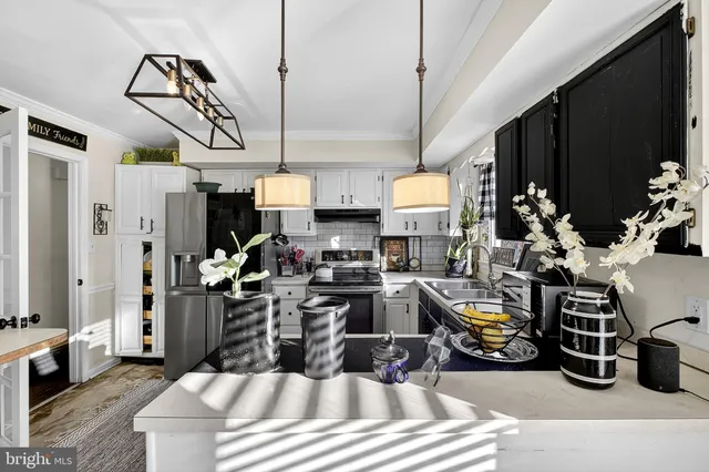 a kitchen with lots of appliances and wooden cabinets