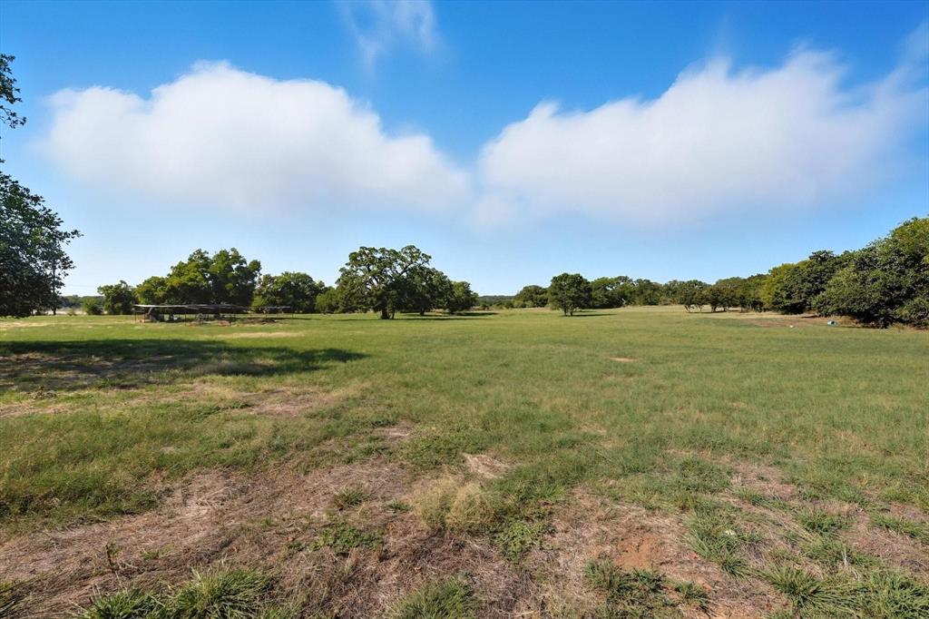 120 Longbranch Road Nocona, TX 76255 - Photo 23 of 23 a view of a lake with houses in the back