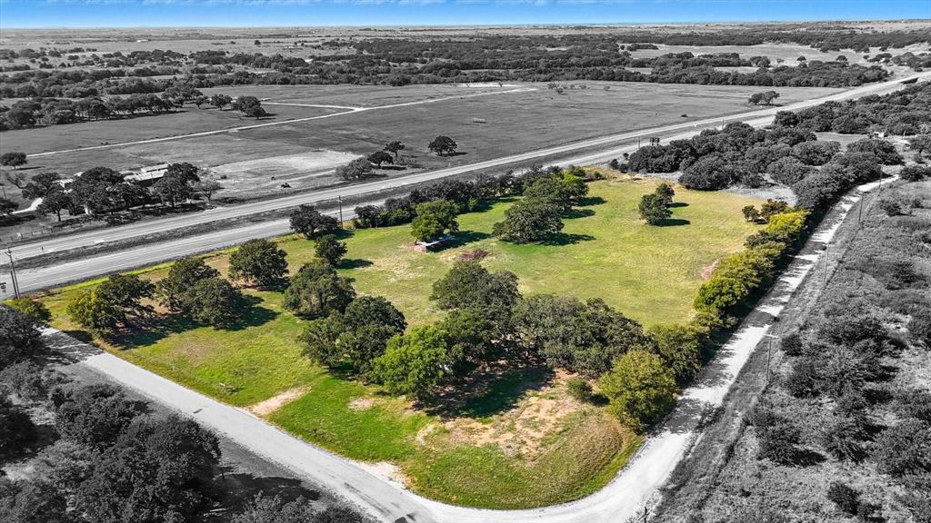 120 Longbranch Road Nocona, TX 76255 - Photo 3 of 23 a view of a swimming pool with a yard and plants