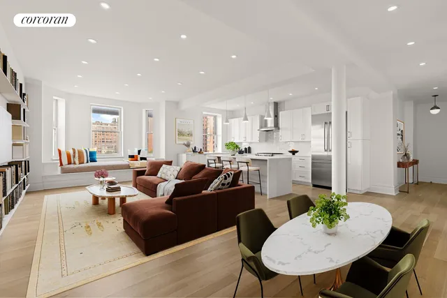 a living room with furniture kitchen view and a wooden floor
