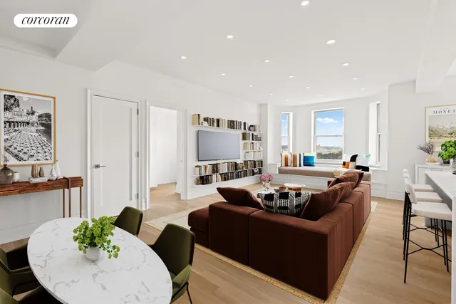 a living room with furniture and a book shelf