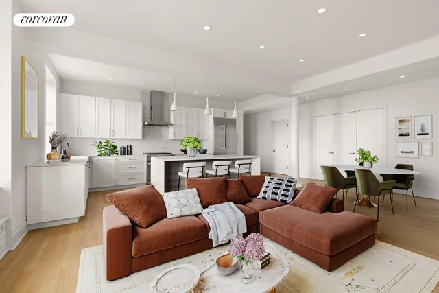 a large kitchen with stainless steel appliances lots of counter space and a sink