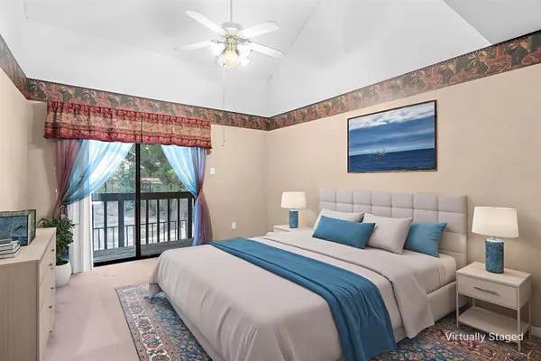 a bedroom with a large bed and a window