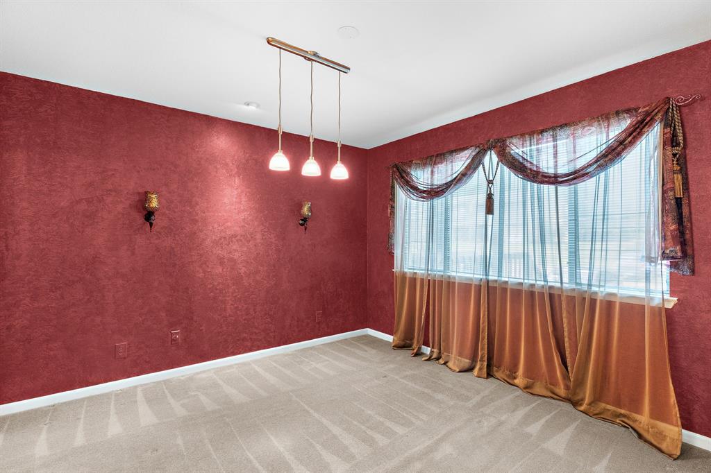 1048 Signal Ridge Place Rockwall, TX 75032 - Photo 20 of 40 a view of an empty room with a window