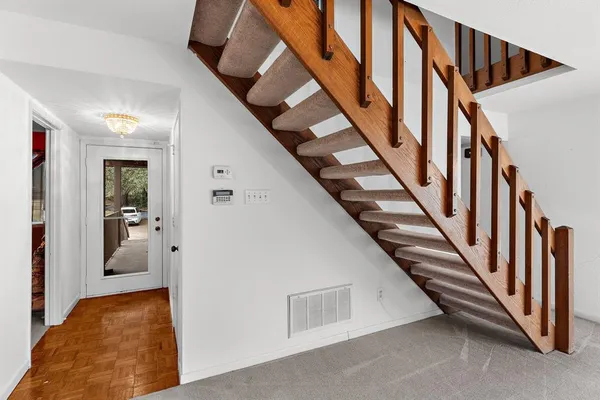 a view of a hallway with staircase