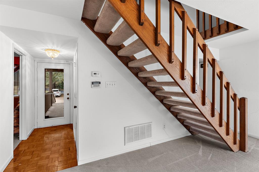1048 Signal Ridge Place Rockwall, TX 75032 - Photo 24 of 40 a view of a hallway with staircase