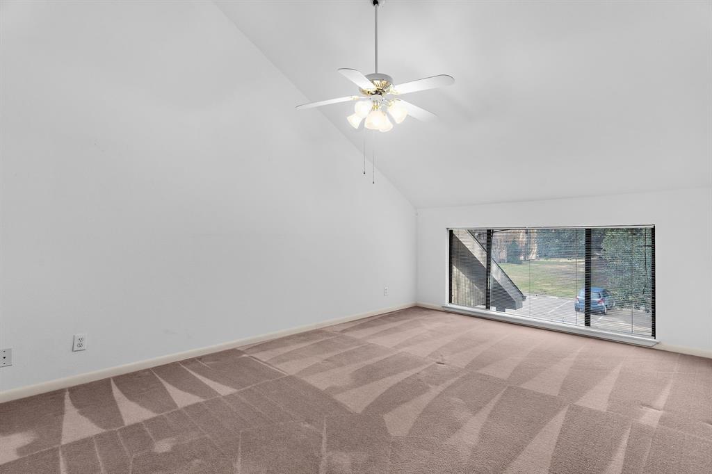 1048 Signal Ridge Place Rockwall, TX 75032 - Photo 27 of 40 a view of an empty room with window and chandelier fan