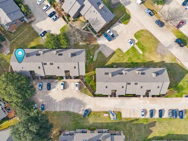 an aerial view of a house with a swimming pool