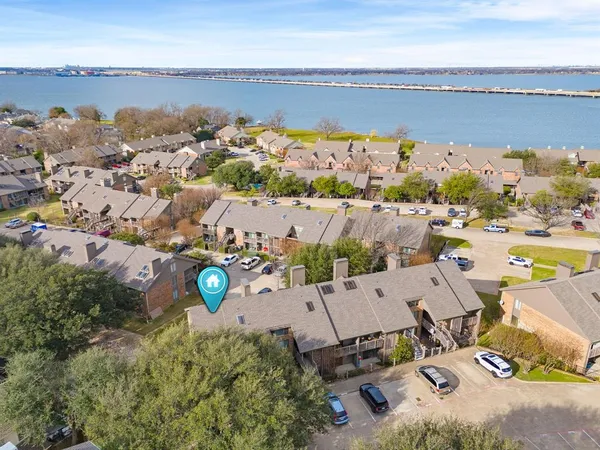 an aerial view of a house with a lake view