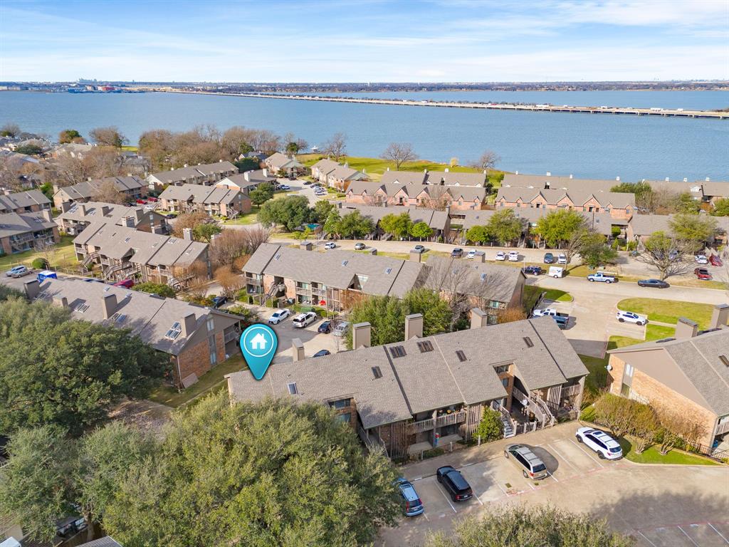 1048 Signal Ridge Place Rockwall, TX 75032 - Photo 35 of 40 an aerial view of a house with a lake view