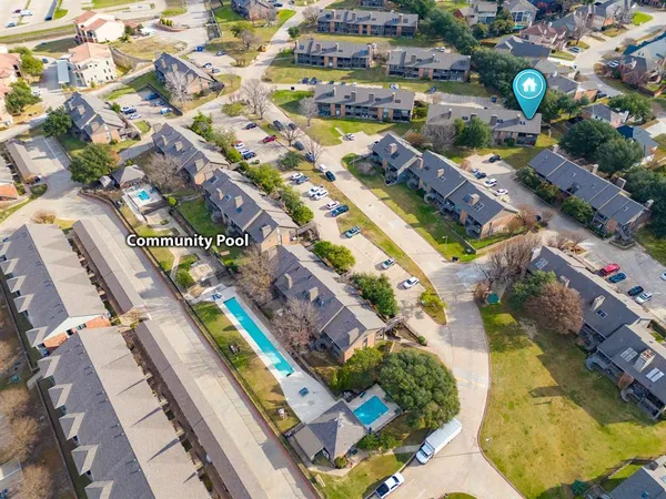 an aerial view of residential houses with outdoor space