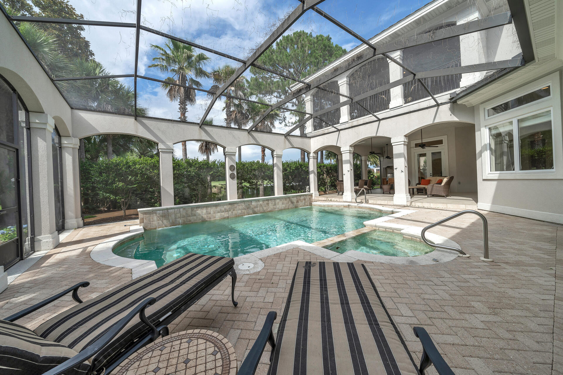 2958 Pine Valley Road Miramar Beach, FL 32550 - Photo 67 of 96 a view of a patio with table and chairs and wooden floor