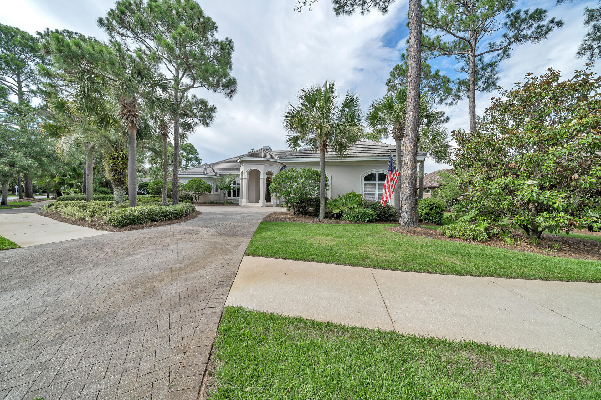 2958 Pine Valley Road Miramar Beach, FL 32550 - Photo 77 of 96 a view of a white house with a small yard and large trees