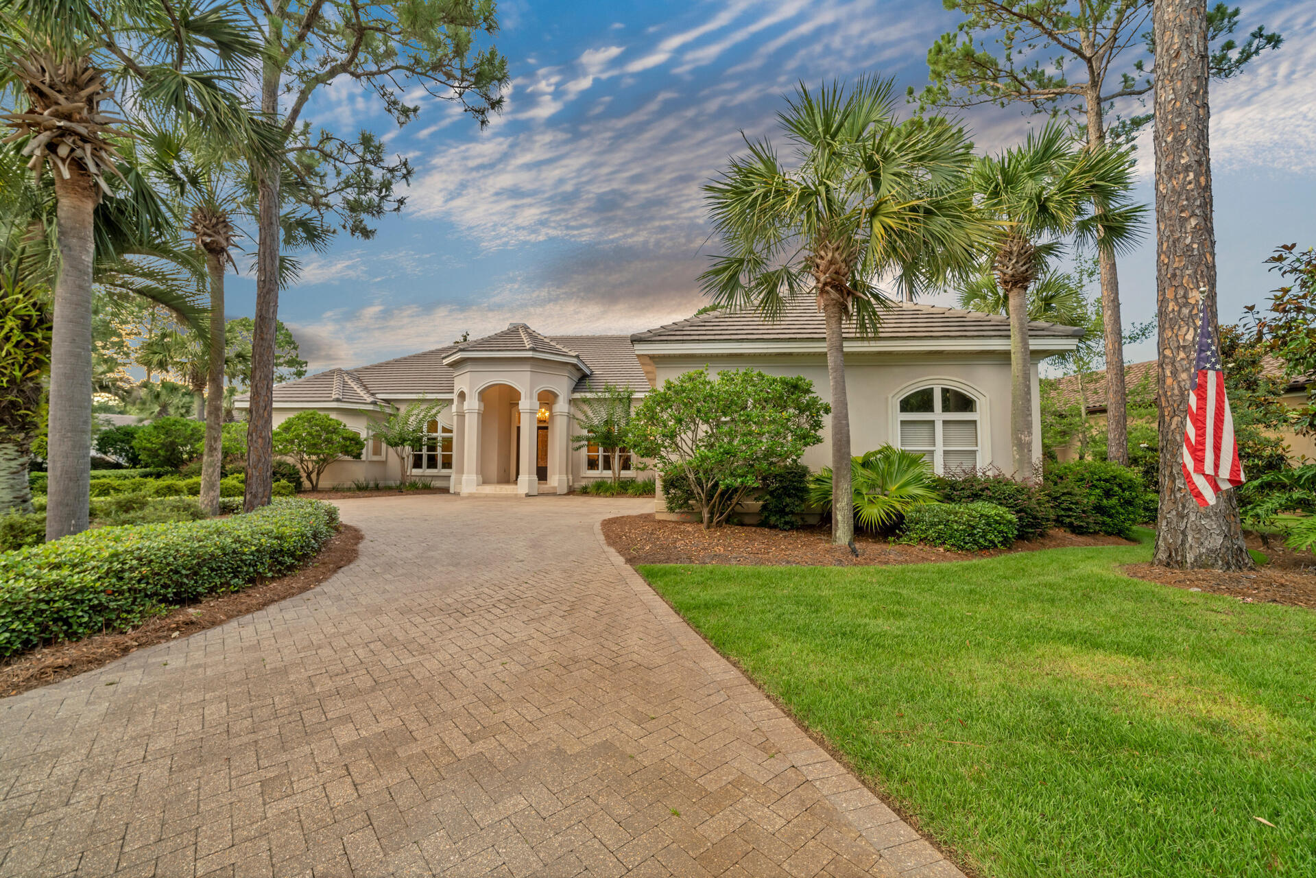 2958 Pine Valley Road Miramar Beach, FL 32550 - Photo 85 of 96 a front view of a house with a yard and potted plants