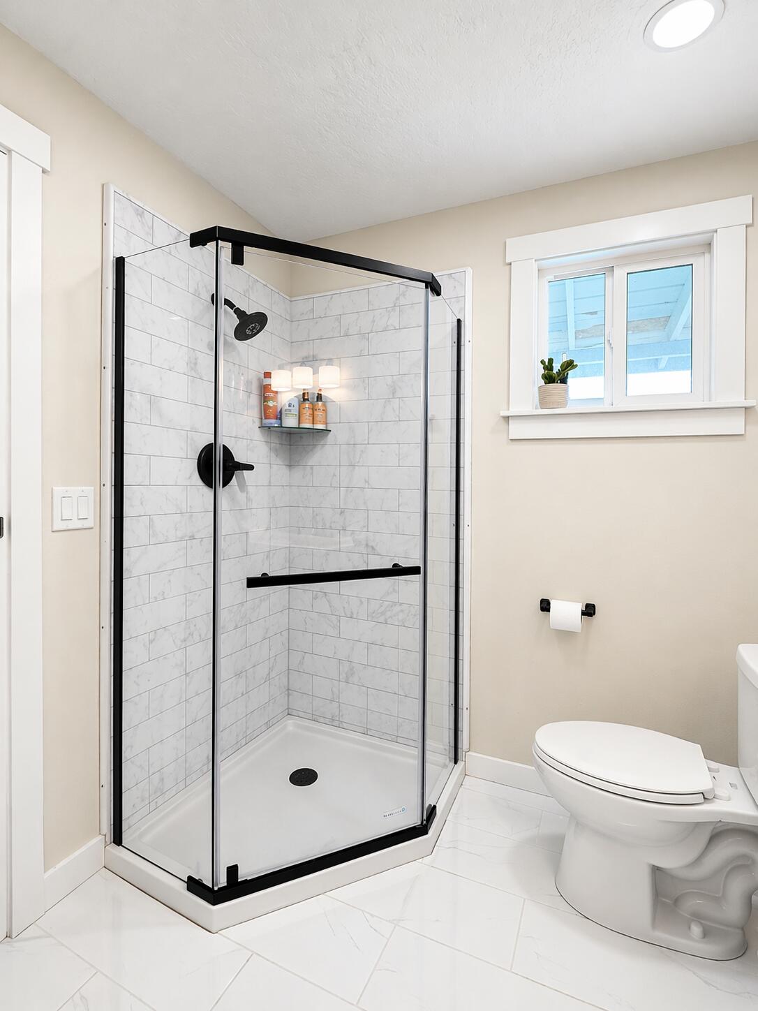 380 Greenleaf Drive Eagle Point, OR 97524 - Photo 23 of 31 a bathroom with a shower a toilet and a window