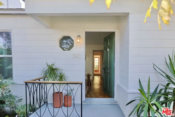 a view of entryway with wooden floor