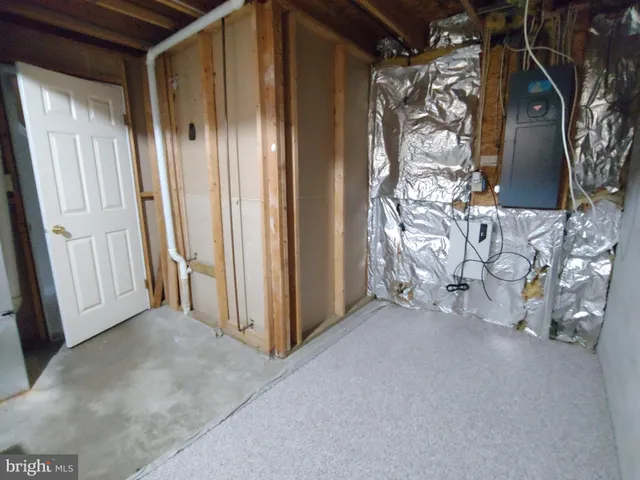 a view of a room with a door and a window