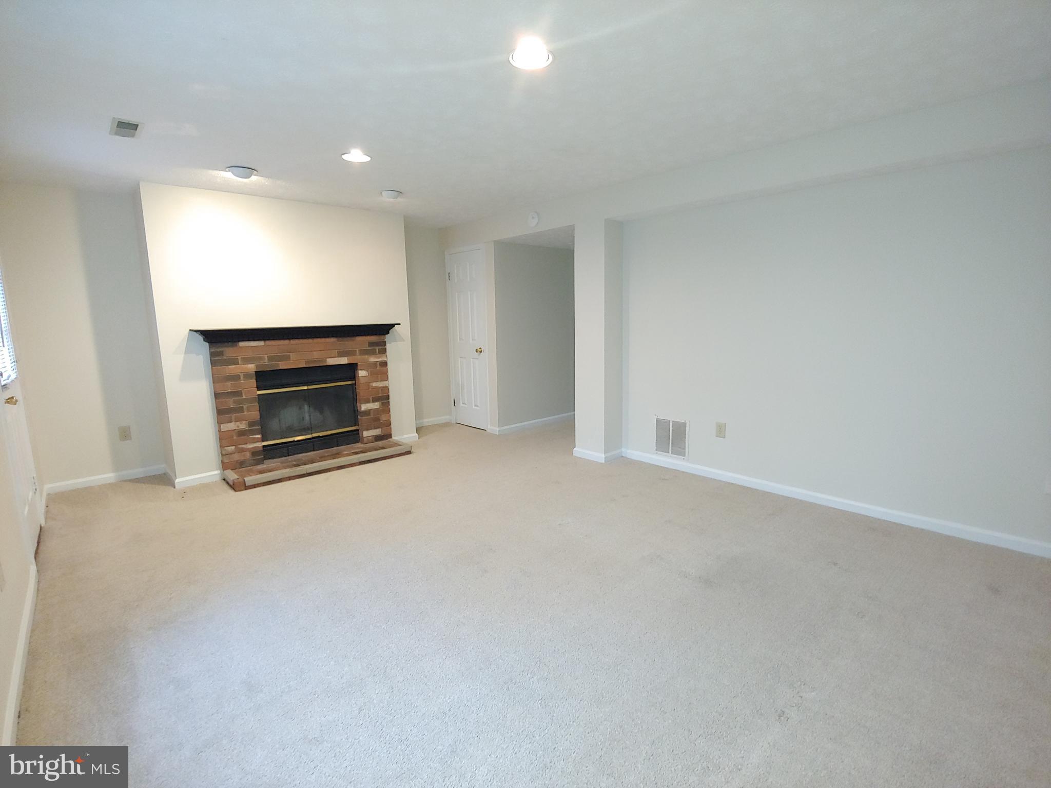 2134 Commissary Circle Odenton, MD 21113 - Photo 21 of 41 an empty room with a fireplace