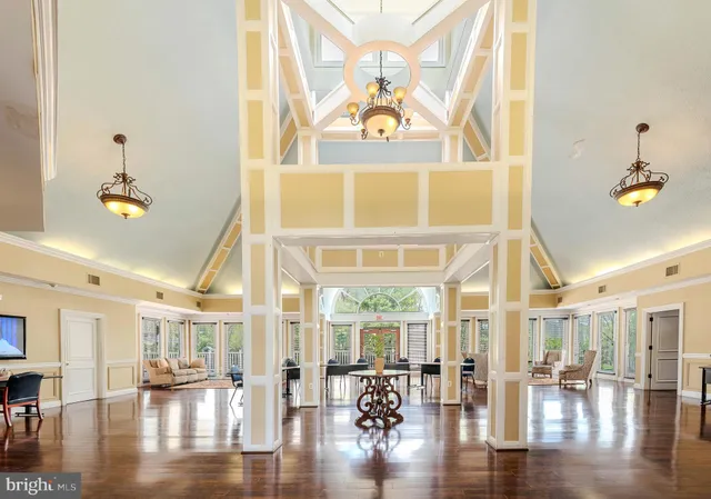a view of a lobby with furniture and wooden floor