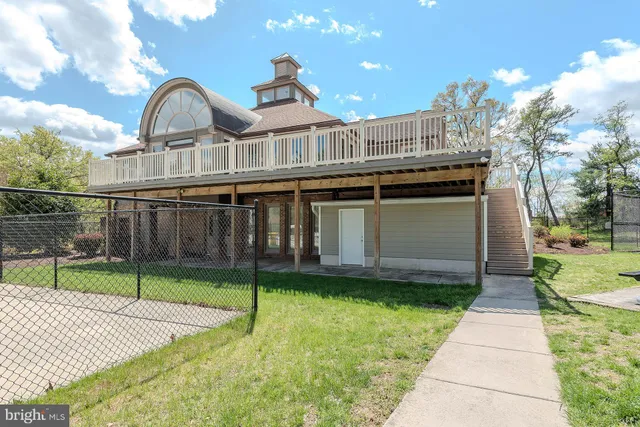 a view of a house with a yard and plants
