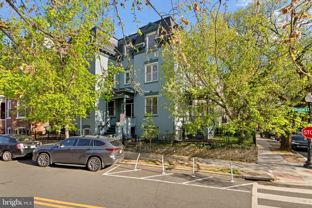 a car parked in front of a building