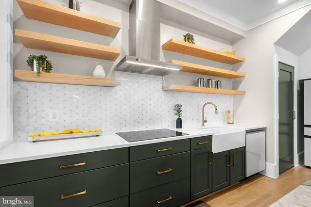 a dining room with furniture a chandelier and wooden floor