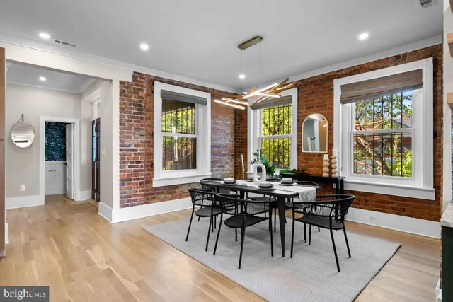 a bedroom with bed and wooden floor