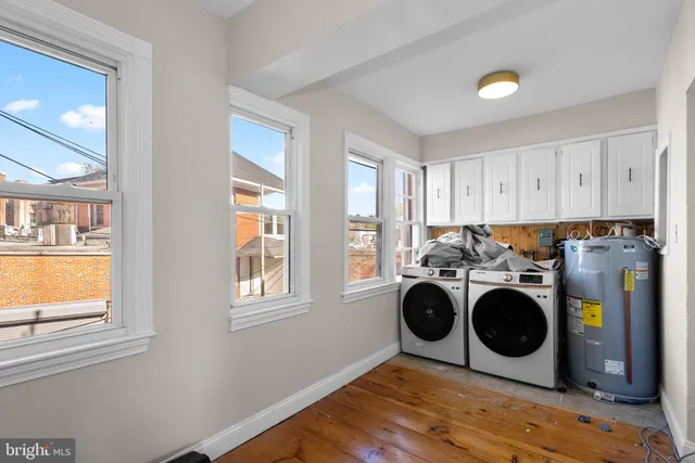 a front view of a building with trees